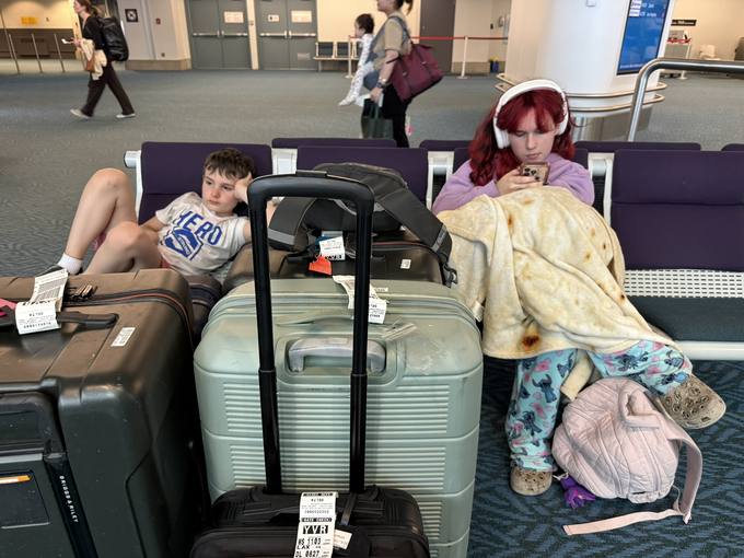 asleep on the luggage